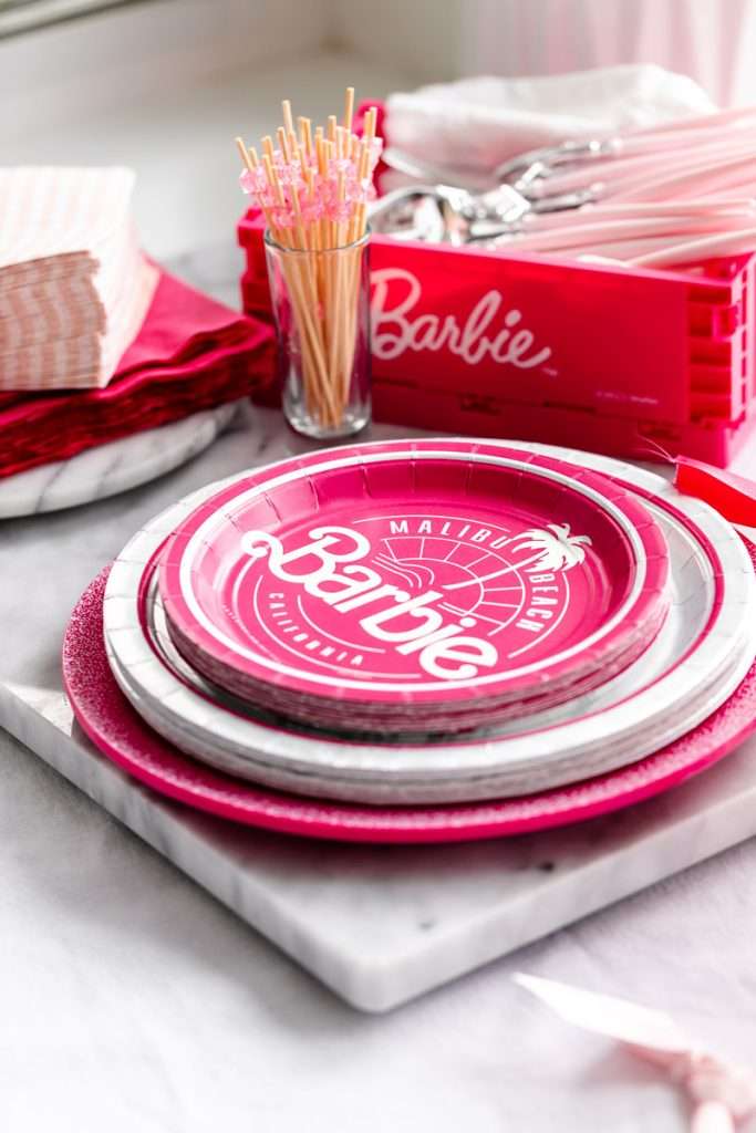 How to throw a Barbie Birthday Party, complete with pink Barbie decor, a life-size barbie box, custom barbie desserts, and details to highlight the iconic theme and movie. Links to all products shared in the post! #barbieparty #barbiemovie
