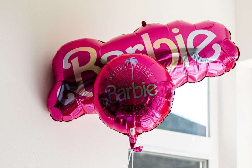 How to throw a Barbie Birthday Party, complete with pink Barbie decor, a life-size barbie box, custom barbie desserts, and details to highlight the iconic theme and movie. Links to all products shared in the post! 
