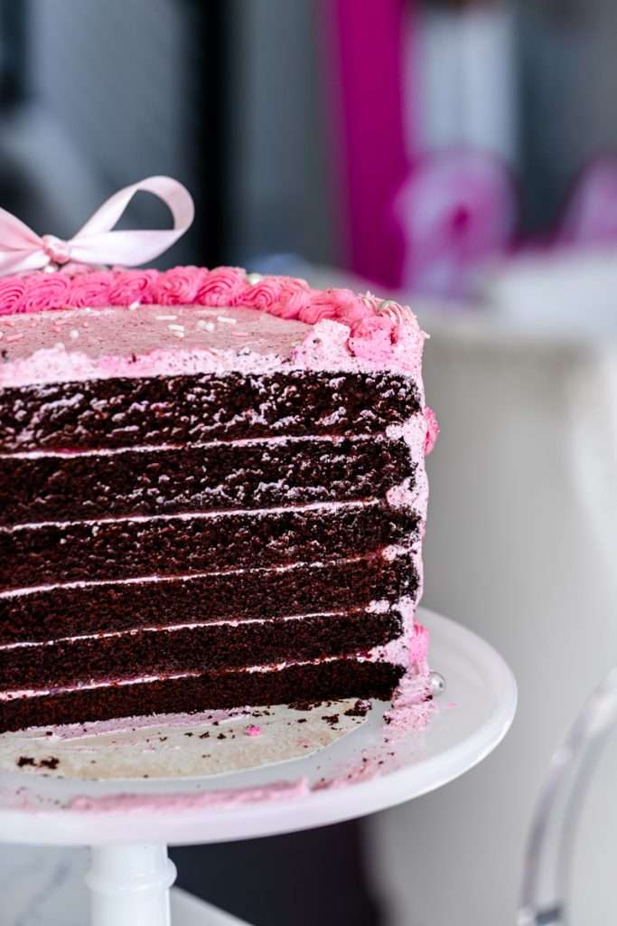 How to throw a Barbie Birthday Party, complete with pink Barbie decor, a life-size barbie box, custom barbie desserts, and details to highlight the iconic theme and movie. Links to all products shared in the post! 