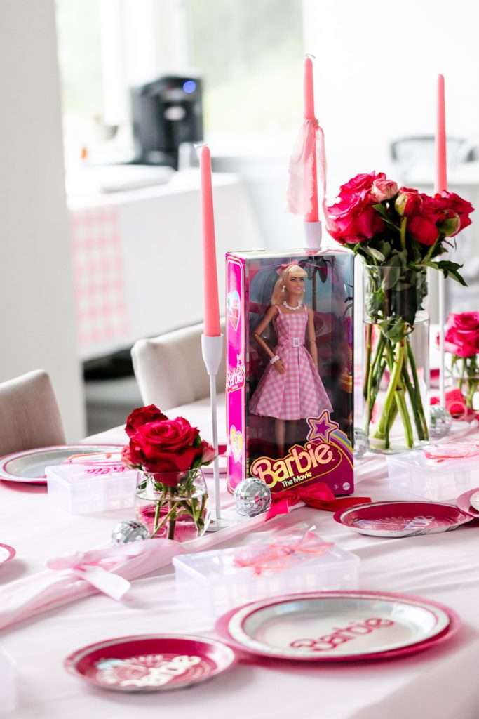 How to throw a Barbie Birthday Party, complete with pink Barbie decor, a life-size barbie box, custom barbie desserts, and details to highlight the iconic theme and movie. Links to all products shared in the post! #barbieparty #barbiemovie
