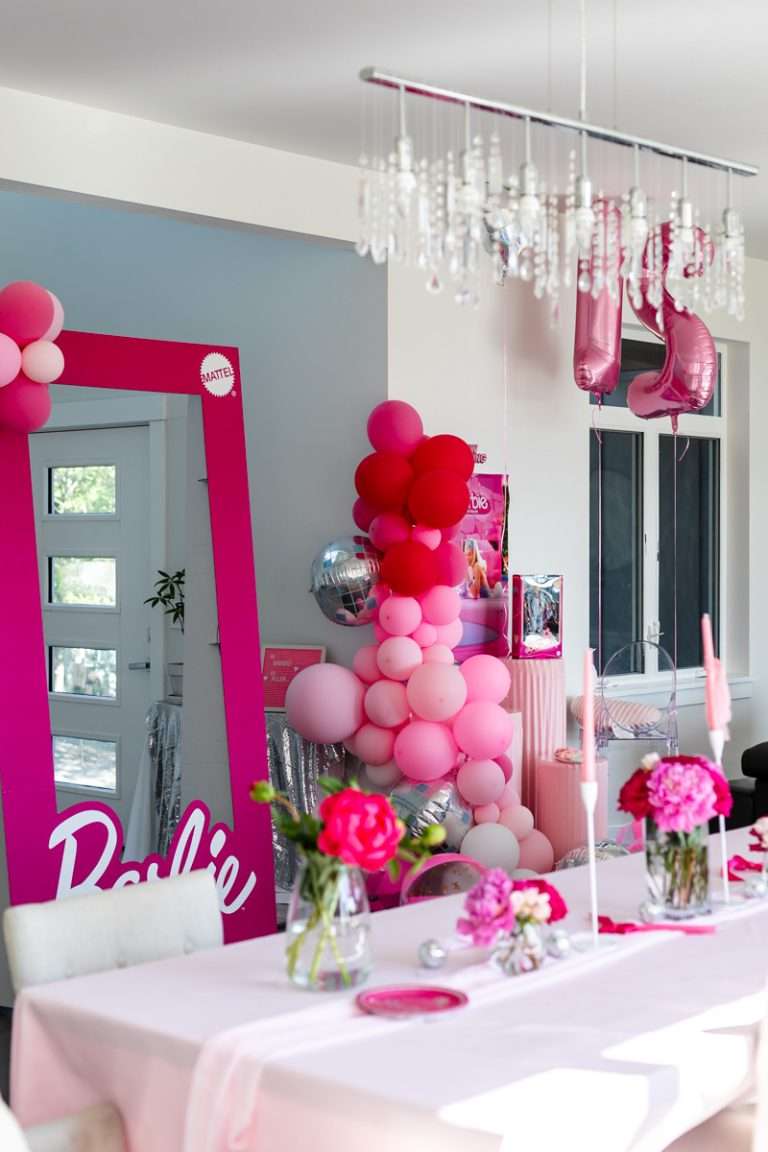 How to throw a Barbie Birthday Party, complete with pink Barbie decor, a life-size barbie box, custom barbie desserts, and details to highlight the iconic theme and movie. Links to all products shared in the post!