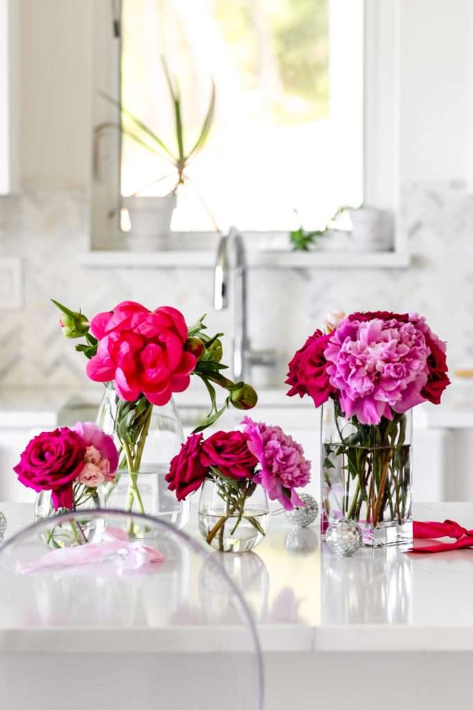 How to throw a Barbie Birthday Party, complete with pink Barbie decor, a life-size barbie box, custom barbie desserts, and details to highlight the iconic theme and movie. Links to all products shared in the post! 