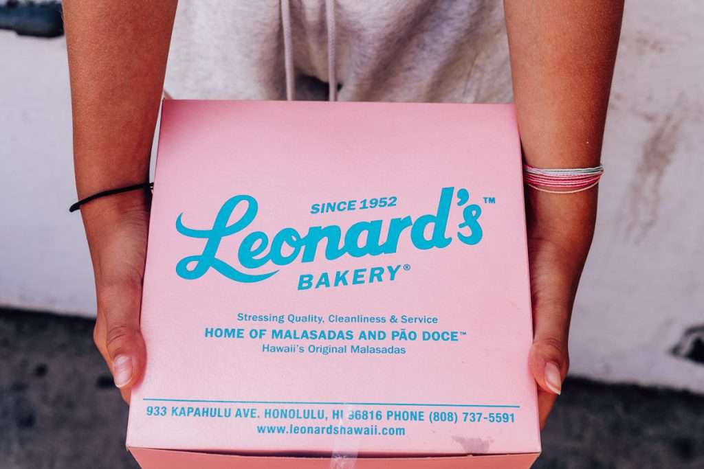 Pink box of Malasadas from Leonard's Bakery in Honolulu Hawaii, Oahu.