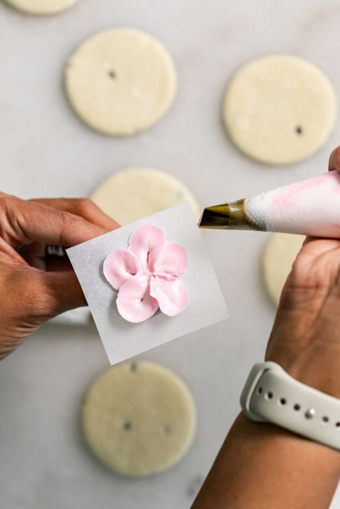 Recipe for tropical sugar cookies, infused with fresh passion fruit and decorated with plumeria royal icing transfers. Step by step instructions and video included.