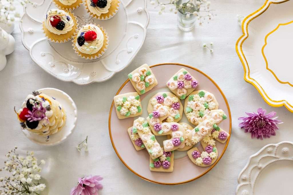 Flower piped sugar cookies for a flower themed 15th birthday party.