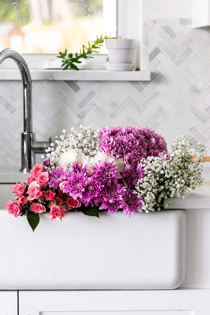Fresh flowers for flower themed teen birthday. Mums, Roses, Babies breath. Party decor