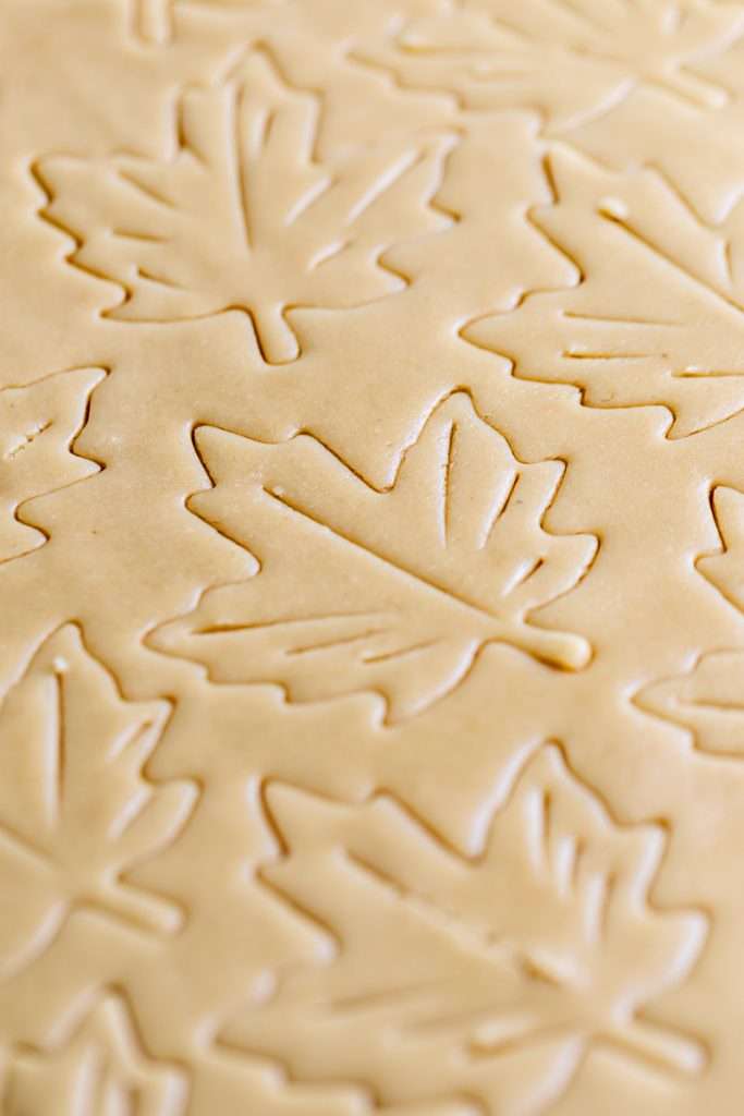 Easy and delicious maple leaf cookies, inspired by Canadian maple cookies filled with maple buttercream and simply decorated with edible gold. A wonderful treat for the fall season and for upcoming fall gatherings. Dairy free option included.
