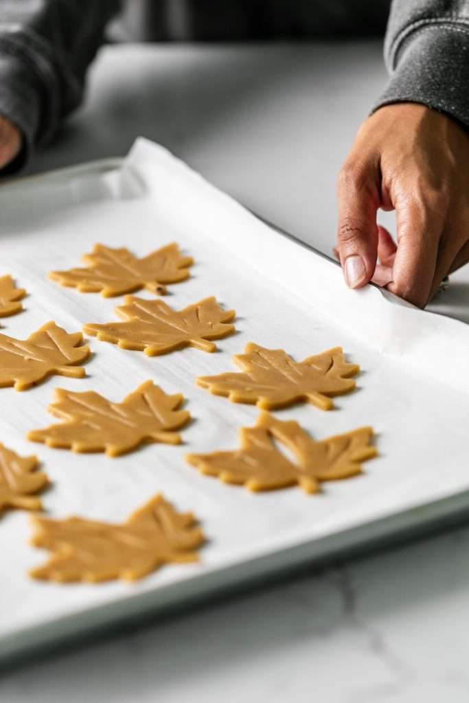 Easy and delicious maple leaf cookies, inspired by Canadian maple cookies filled with maple buttercream and simply decorated with edible gold. A wonderful treat for the fall season and for upcoming fall gatherings. Dairy free option included.