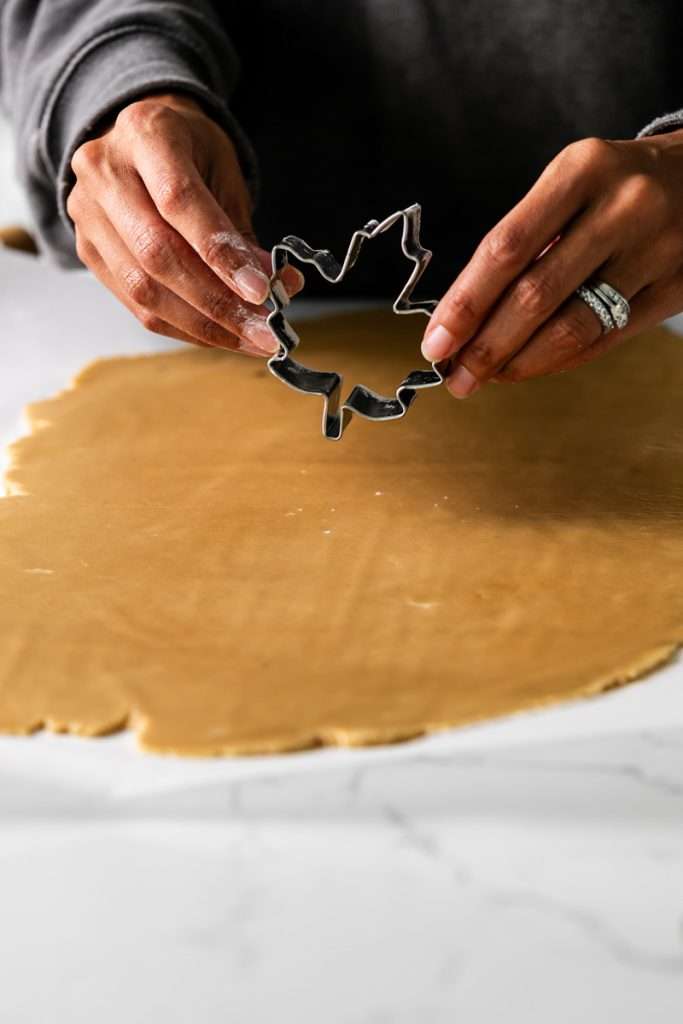 Easy and delicious maple leaf cookies, inspired by Canadian maple cookies filled with maple buttercream and simply decorated with edible gold. A wonderful treat for the fall season and for upcoming fall gatherings. Dairy free option included.
