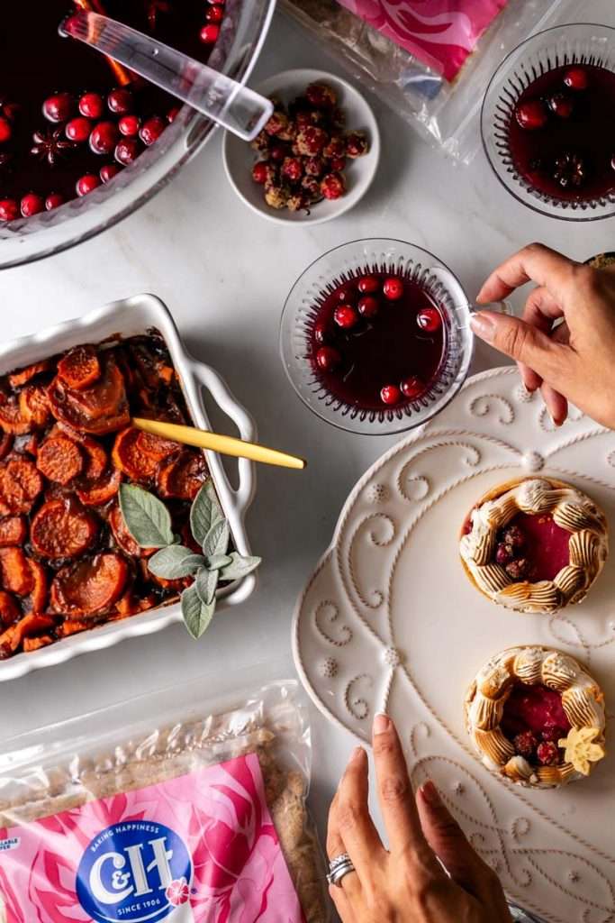 Thanksgiving with C&H Sugar. Cranberry pomegranate punch, candied yams and cranberry meringue tarts.
