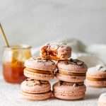 Almond Apricot Macarons filled with almond flavored ganache and apricot preserves. An effortless and delicious macaron flavor for the spring and summer season. Recipe is dairy free and gluten free.
