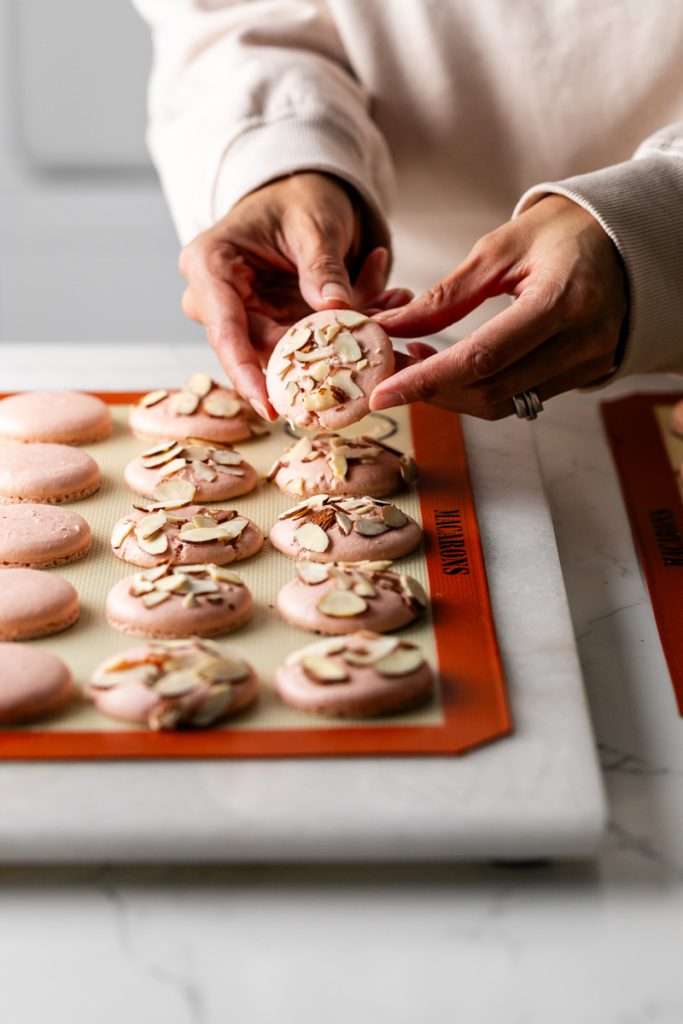 Almond Apricot Macarons filled with almond flavored ganache and apricot preserves. An effortless and delicious macaron flavor for the spring and summer season. Recipe is dairy free and gluten free.
