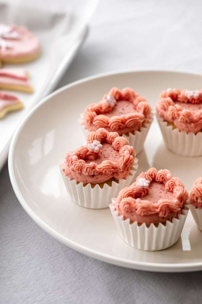Heart shaped strawberry cupcakes with vintage lambeth piping for coquette themed birthday