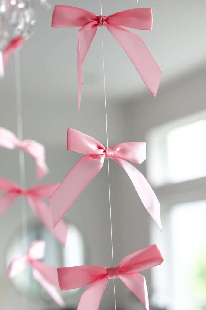 Floating bow party decorations for coquette bow birthday party