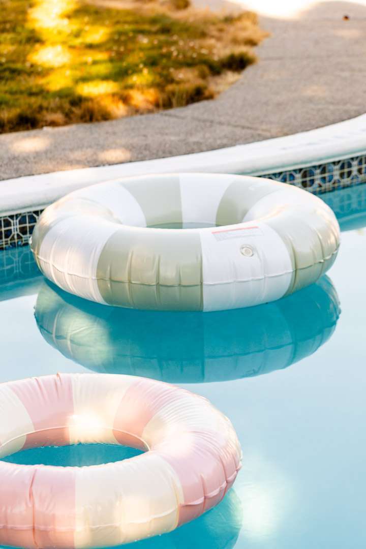 Pink white and green striped pool floats for teen cabana themed pool party. Fun boy floats.