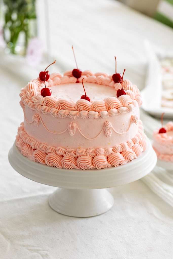 8" pink raspberry piped lambeth cake with cherries for sweet sixteen birthday party.