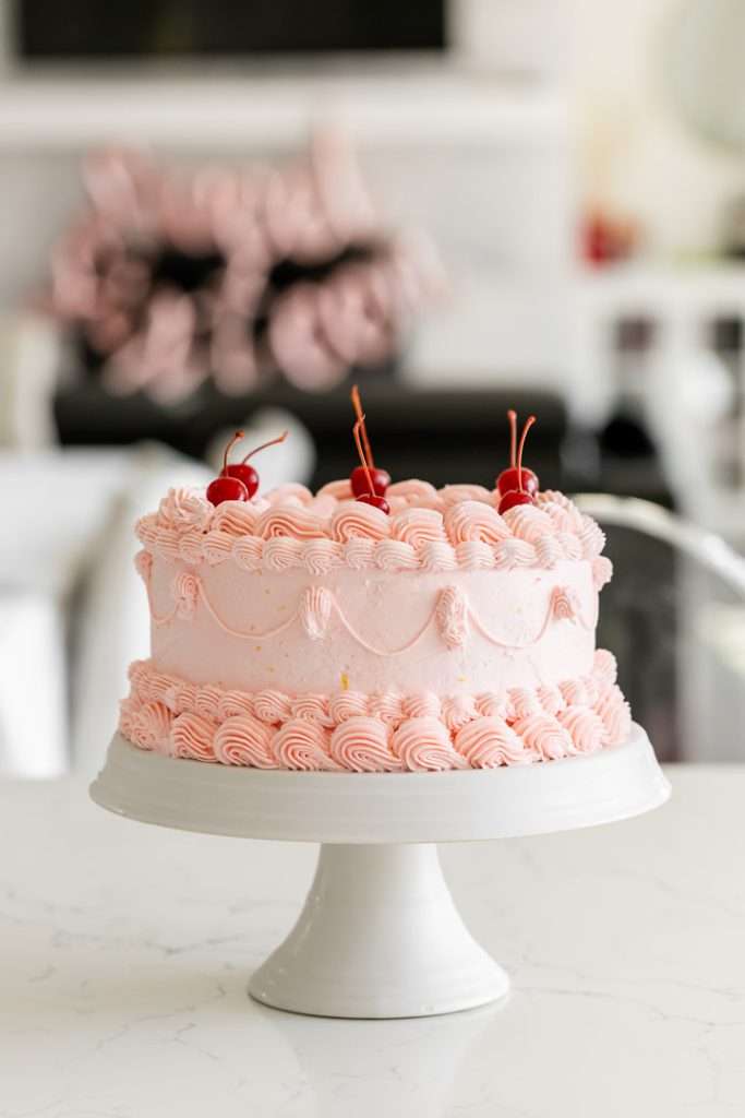 8" pink raspberry piped lambeth cake with cherries for sweet sixteen birthday party.
