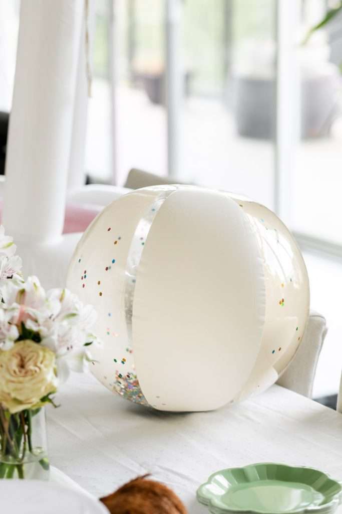 Glitter beach balls for teen cabana themed pool party.