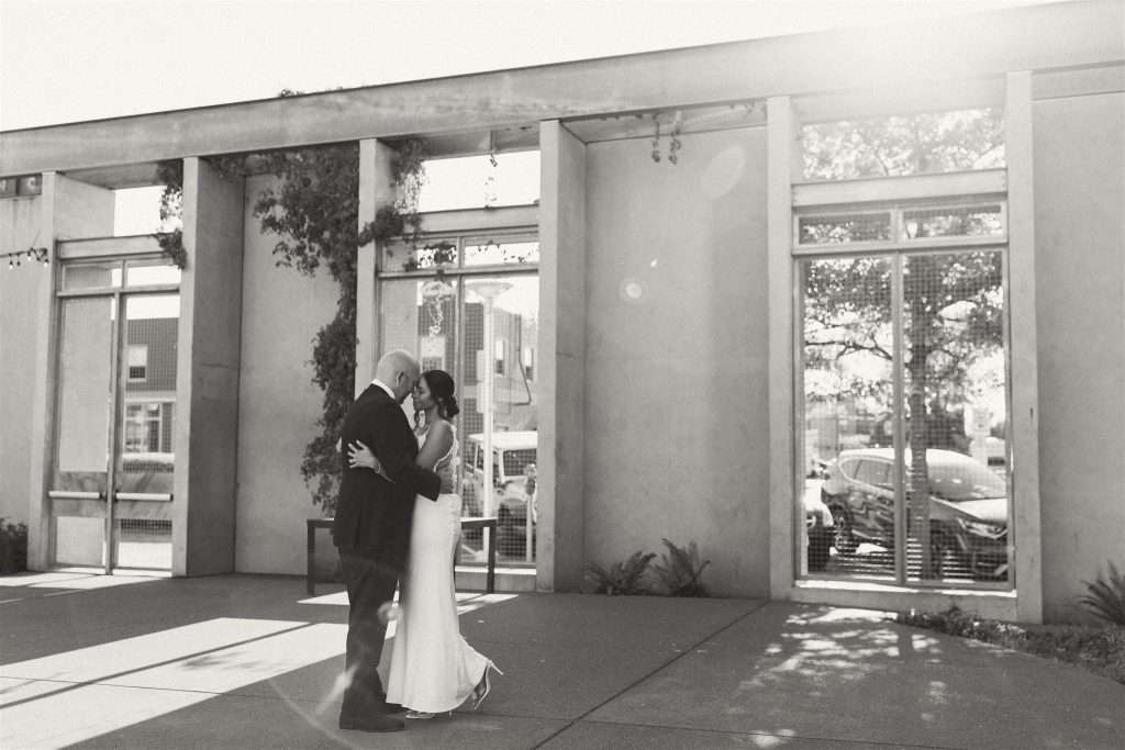 Couple celebrating their 20 year wedding anniversary at a black and white themed party