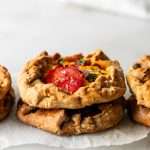 Mini tomato galettes, the perfect party appetizer or brunch treat! Flaky pastry, creamy goat cheese and fresh garden tomatoes, and baked until golden brown.