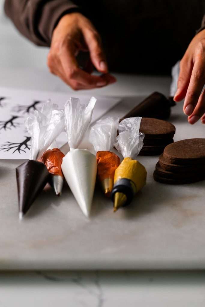 Rich chocolate sugar cookies topped with chocolate royal icing and spooky 3D Halloween details. A festive and delicious treat for the fall season, with step by step decorating instructions.