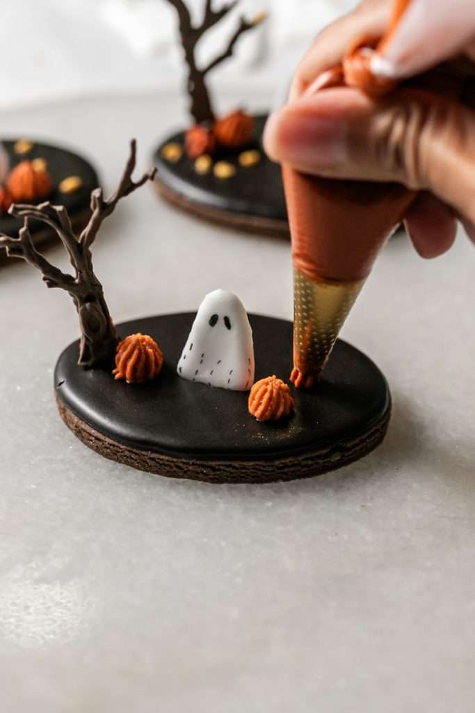 Rich chocolate sugar cookies topped with chocolate royal icing and spooky 3D Halloween details. A festive and delicious treat for the fall season, with step by step decorating instructions.