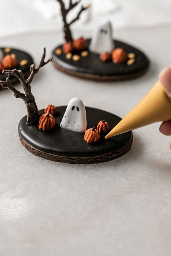 These 3D chocolate sugar cookies are decorated with rich chocolate royal icing and festive Halloween details. Featuring spooky icing transfers, they are not only delicious but perfect for dessert tables. cookie decorating inspiration and halloween themed parties.