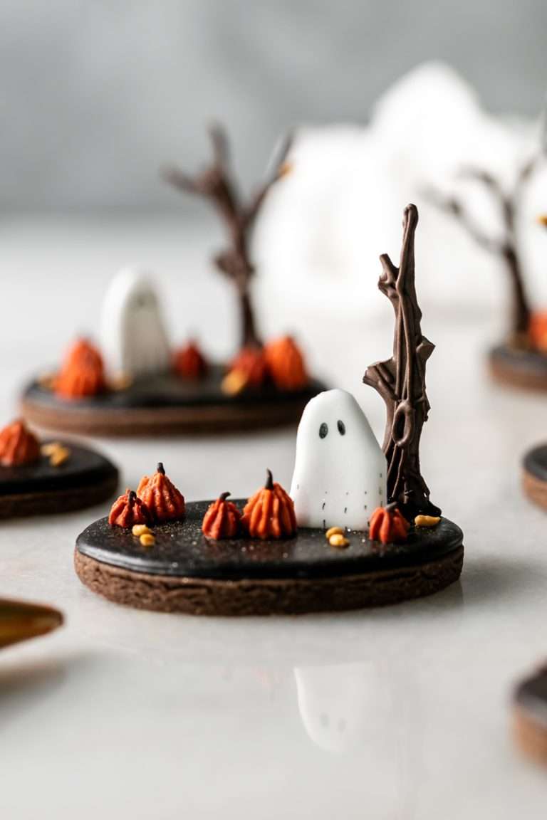 These 3D chocolate sugar cookies are decorated with rich chocolate royal icing and festive Halloween details. Featuring spooky icing transfers, they are not only delicious but perfect for dessert tables. cookie decorating inspiration and halloween themed parties.