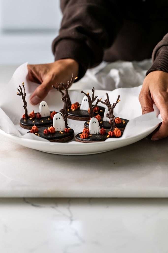 Rich chocolate sugar cookies topped with chocolate royal icing and spooky 3D Halloween details. A festive and delicious treat for the fall season, with step by step decorating instructions.