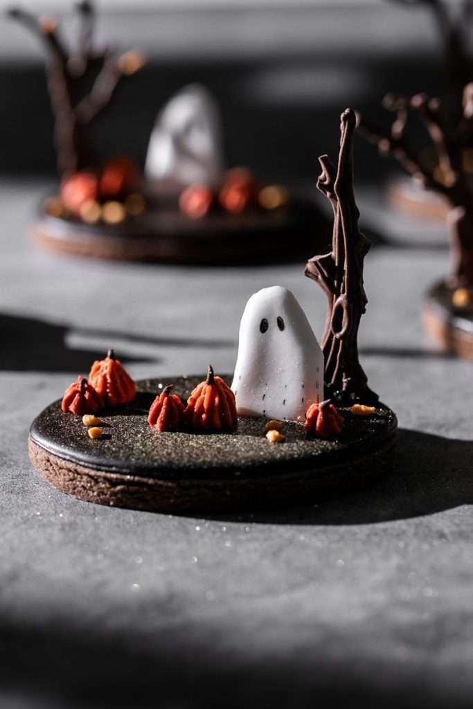 Rich chocolate sugar cookies topped with chocolate royal icing and spooky 3D Halloween details. A festive and delicious treat for the fall season, with step by step decorating instructions.
