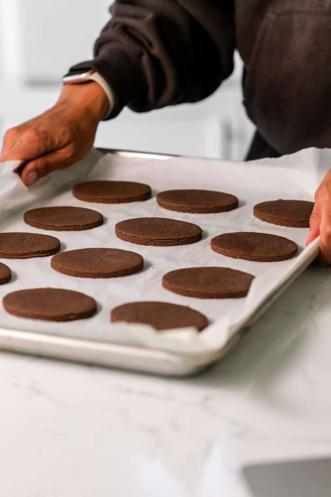 Rich chocolate sugar cookies topped with chocolate royal icing and spooky 3D Halloween details. A festive and delicious treat for the fall season, with step by step decorating instructions.
