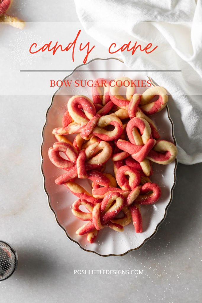 Peppermint infused candy cane bow sugar cookies shaped and twisted into bows and arranged on a holiday themed surface.