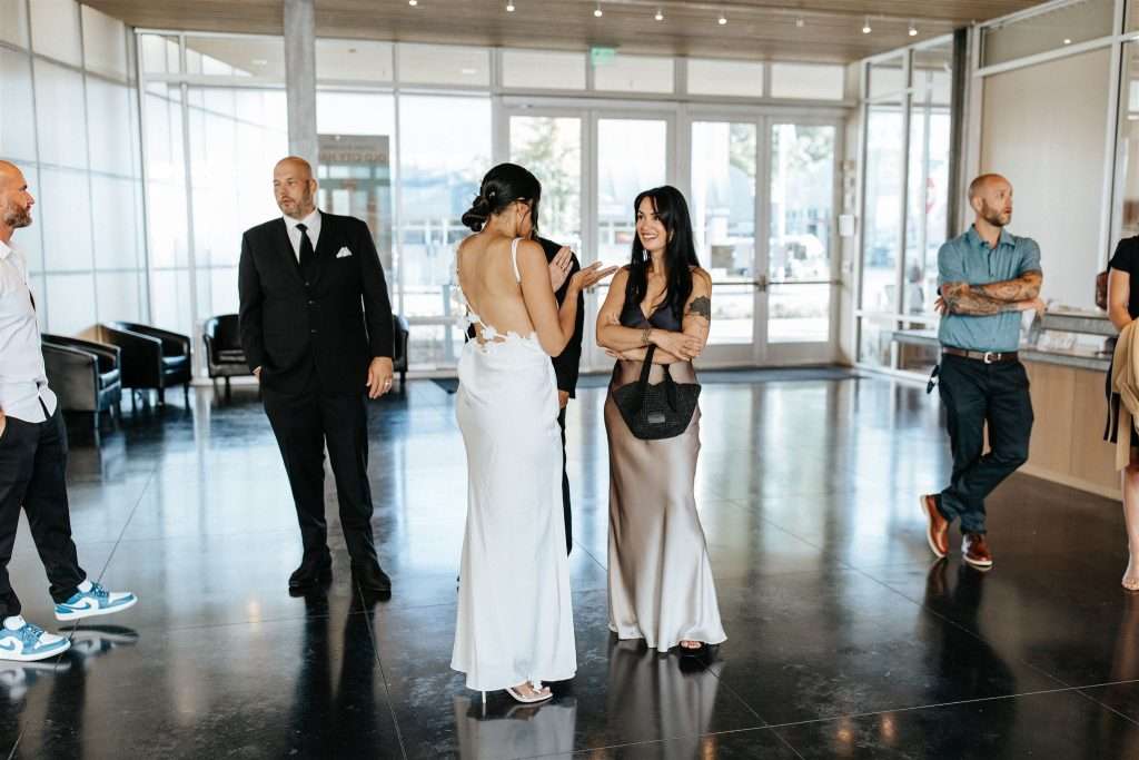Family gathered at a 20 year wedding anniversary party with black and white decor