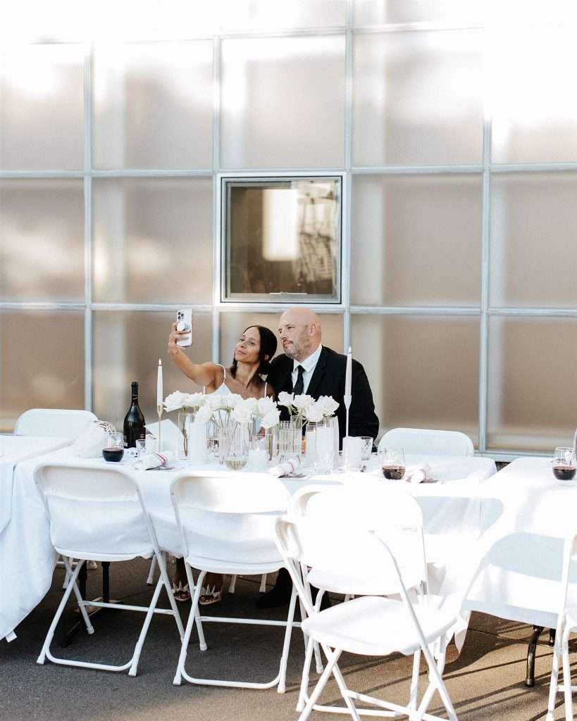 Couple celebrating their 20 year wedding anniversary at a black and white themed party
