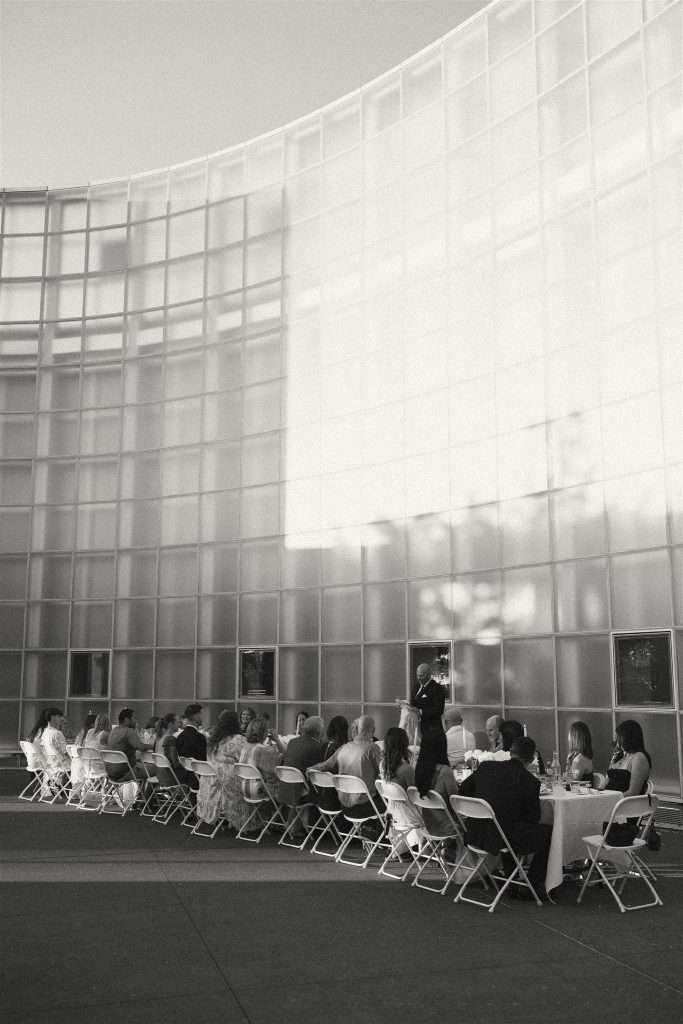 Family gathered at a 20 year wedding anniversary party with black and white decor