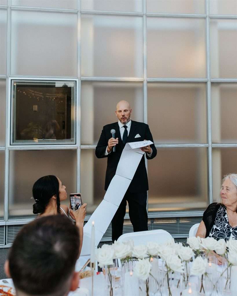 Couple celebrating their 20 year wedding anniversary at a black and white themed party