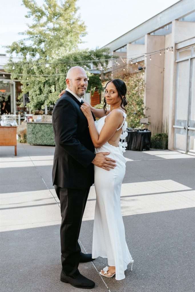 Couple celebrating their 20 year wedding anniversary at a black and white themed party