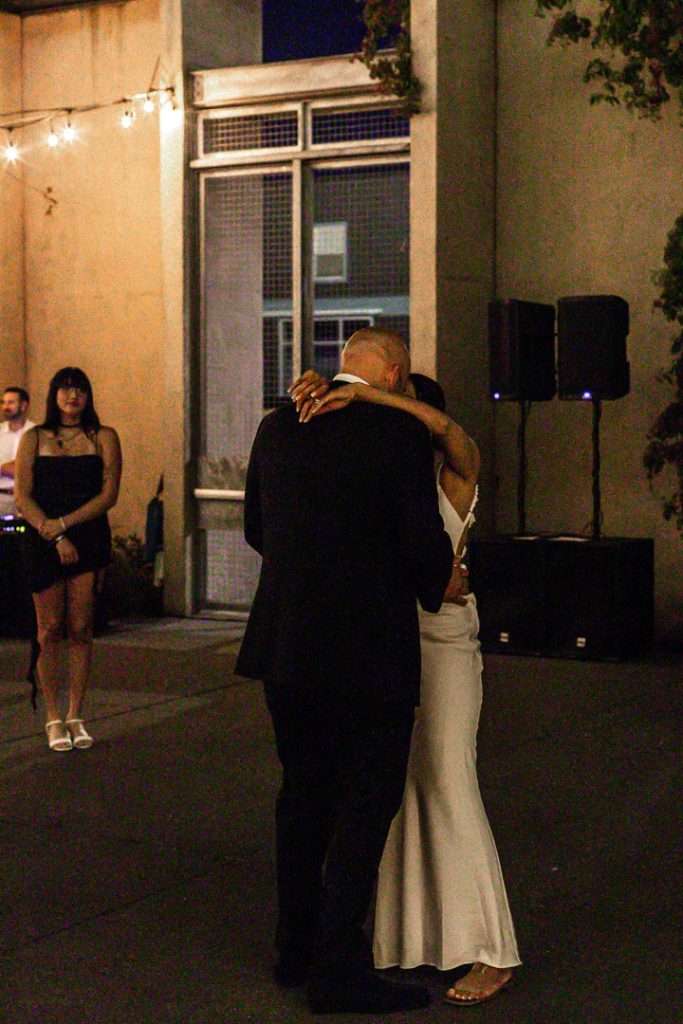 Couple celebrating their 20 year wedding anniversary at a black and white themed party