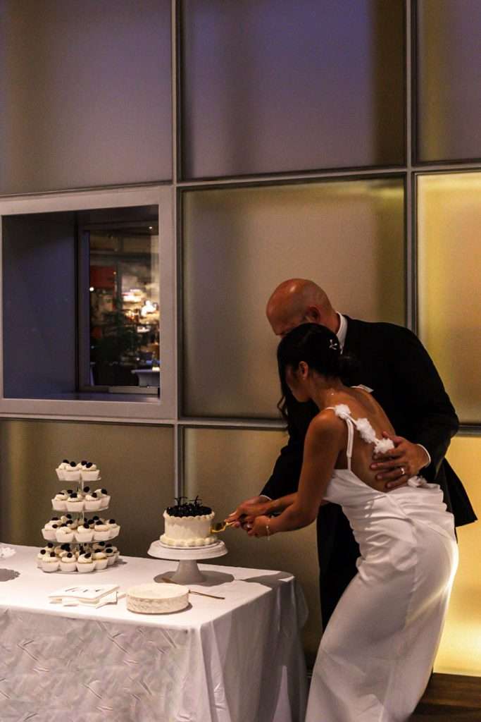 Couple celebrating their 20 year wedding anniversary at a black and white themed party