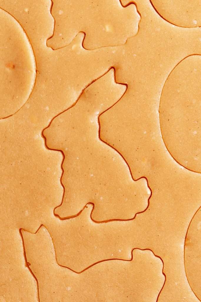 Shaped peanut butter sugar cookies on a sheet of parchment