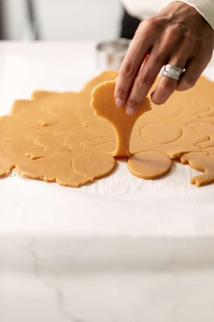 Shaped peanut butter sugar cookies on a sheet of parchment