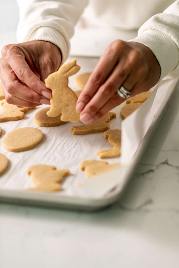 Shaped peanut butter sugar cookies on a sheet of parchment
